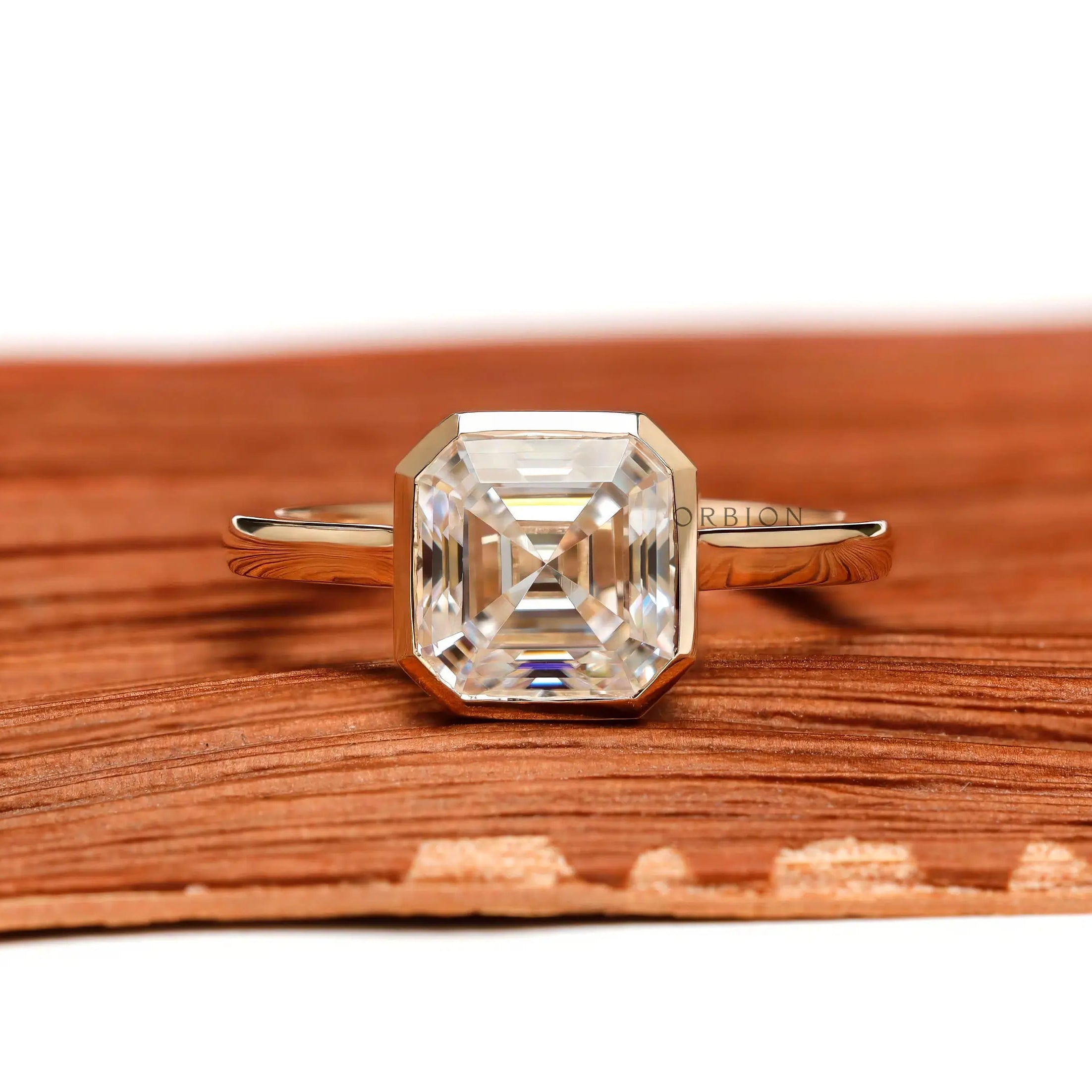 Asscher moissanite bezel cathedral solitaire ring front view