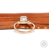 Bezel set Asscher solitaire ring with cathedral profile side view