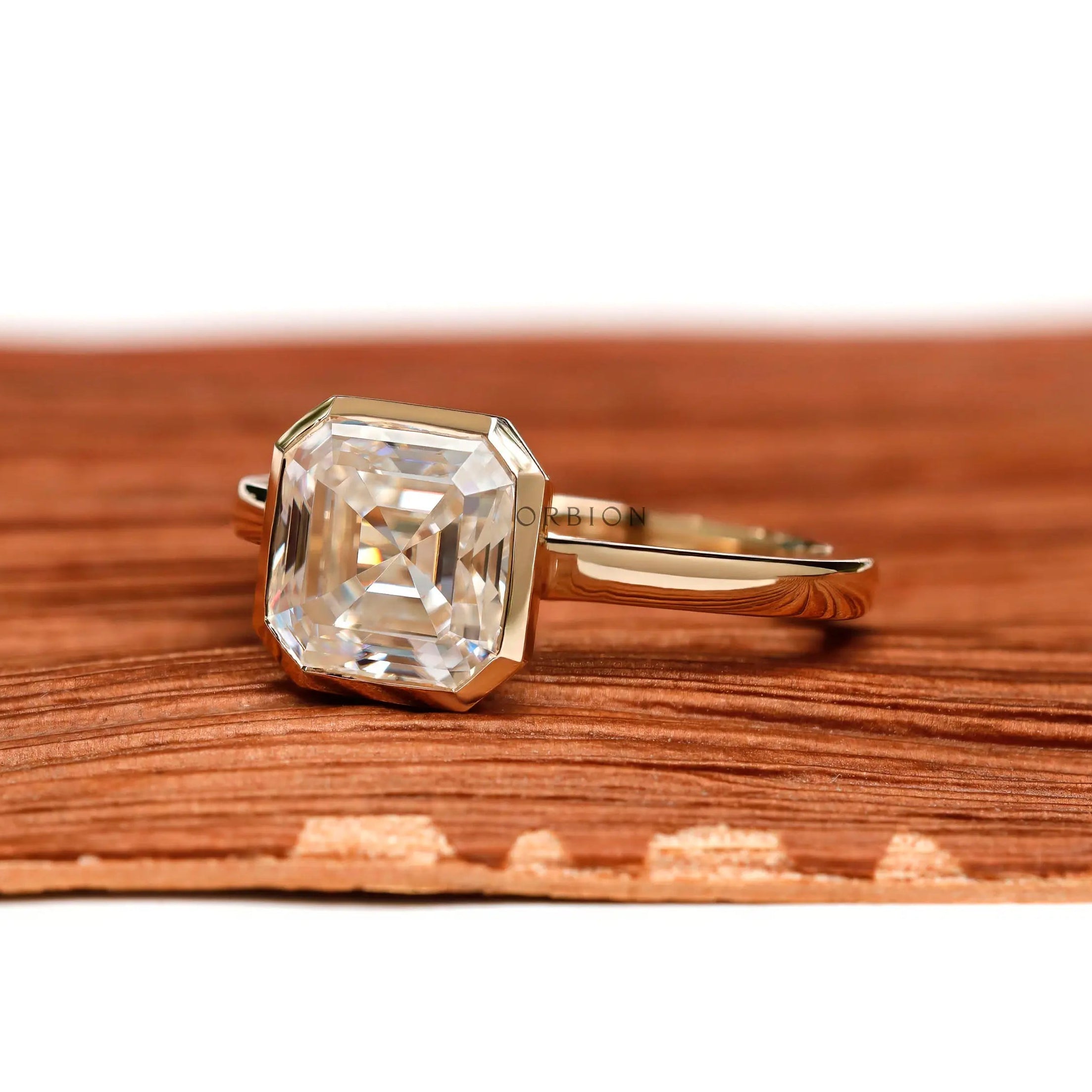 Asscher cut moissanite bezel solitaire ring angled view