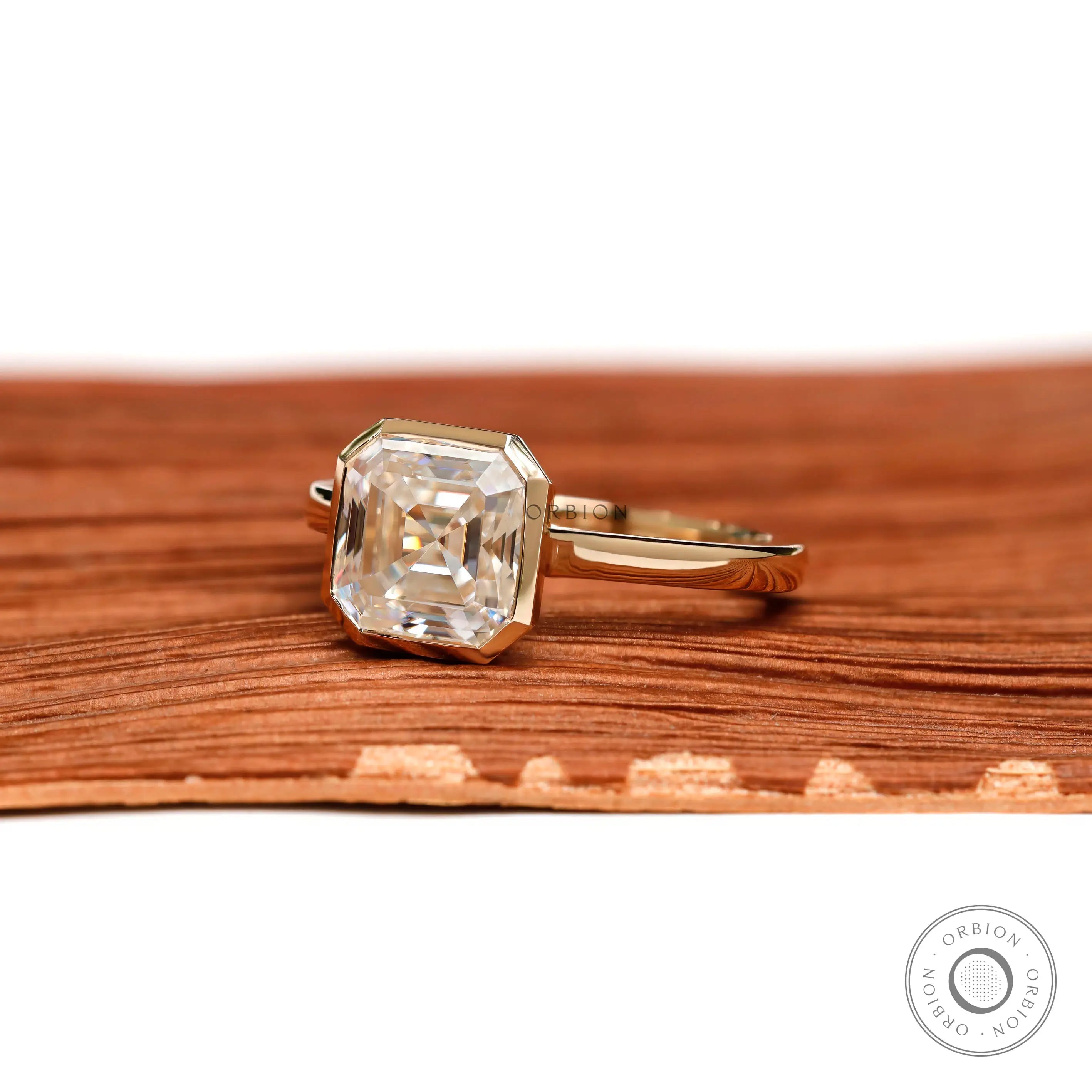 Asscher cut moissanite bezel solitaire ring angled view