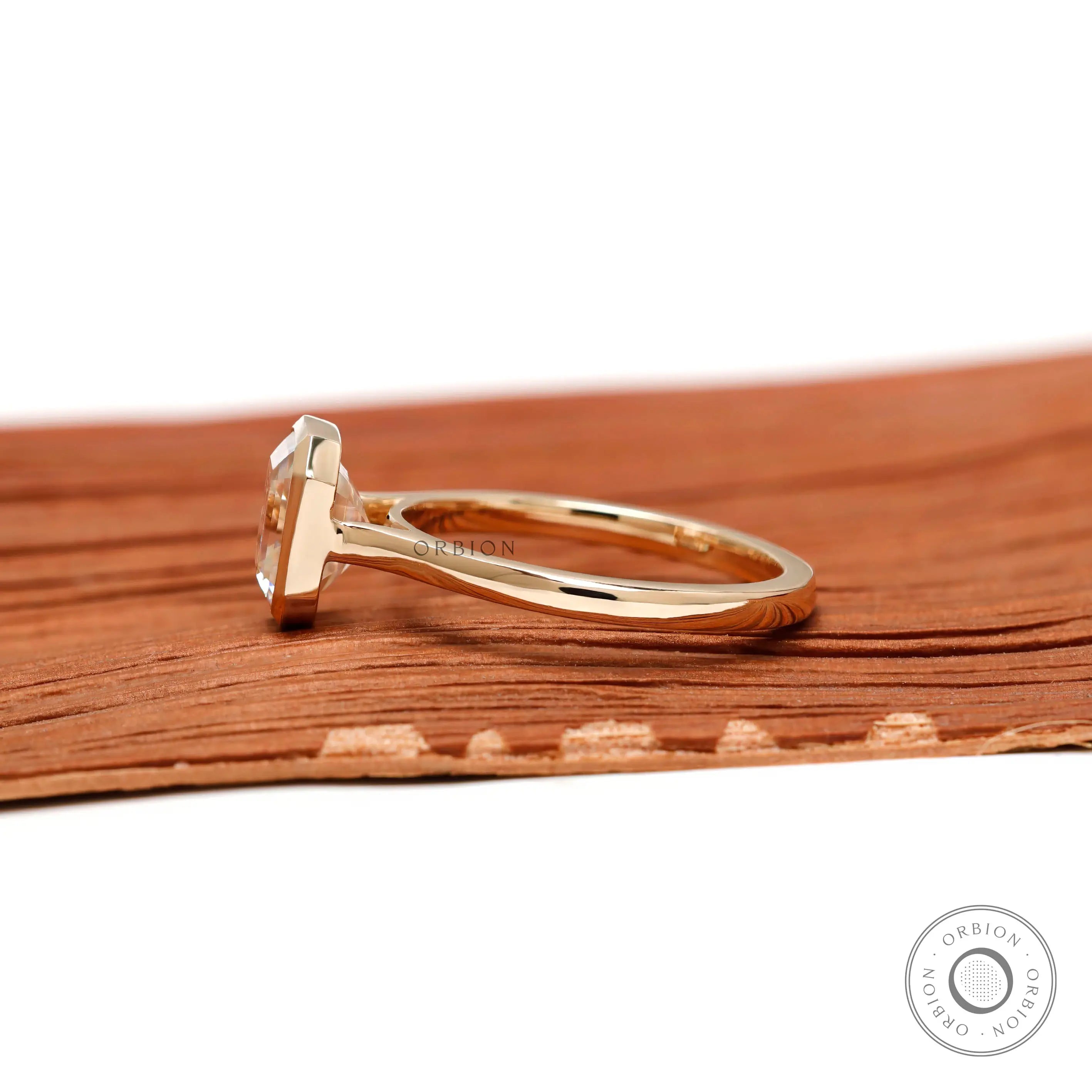 Cathedral setting bezel solitaire ring showing band structure