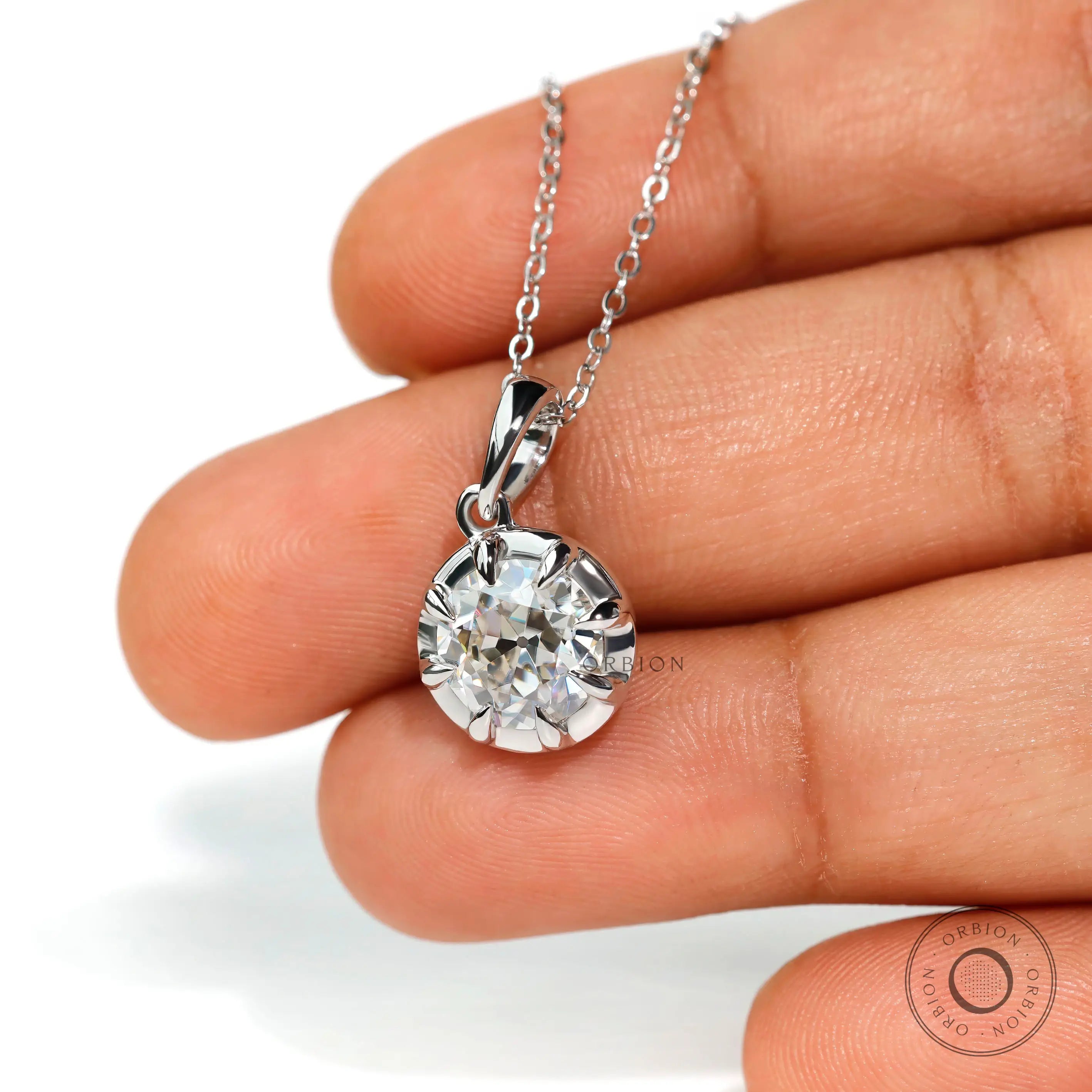 Side profile of vintage bezel set round pendant