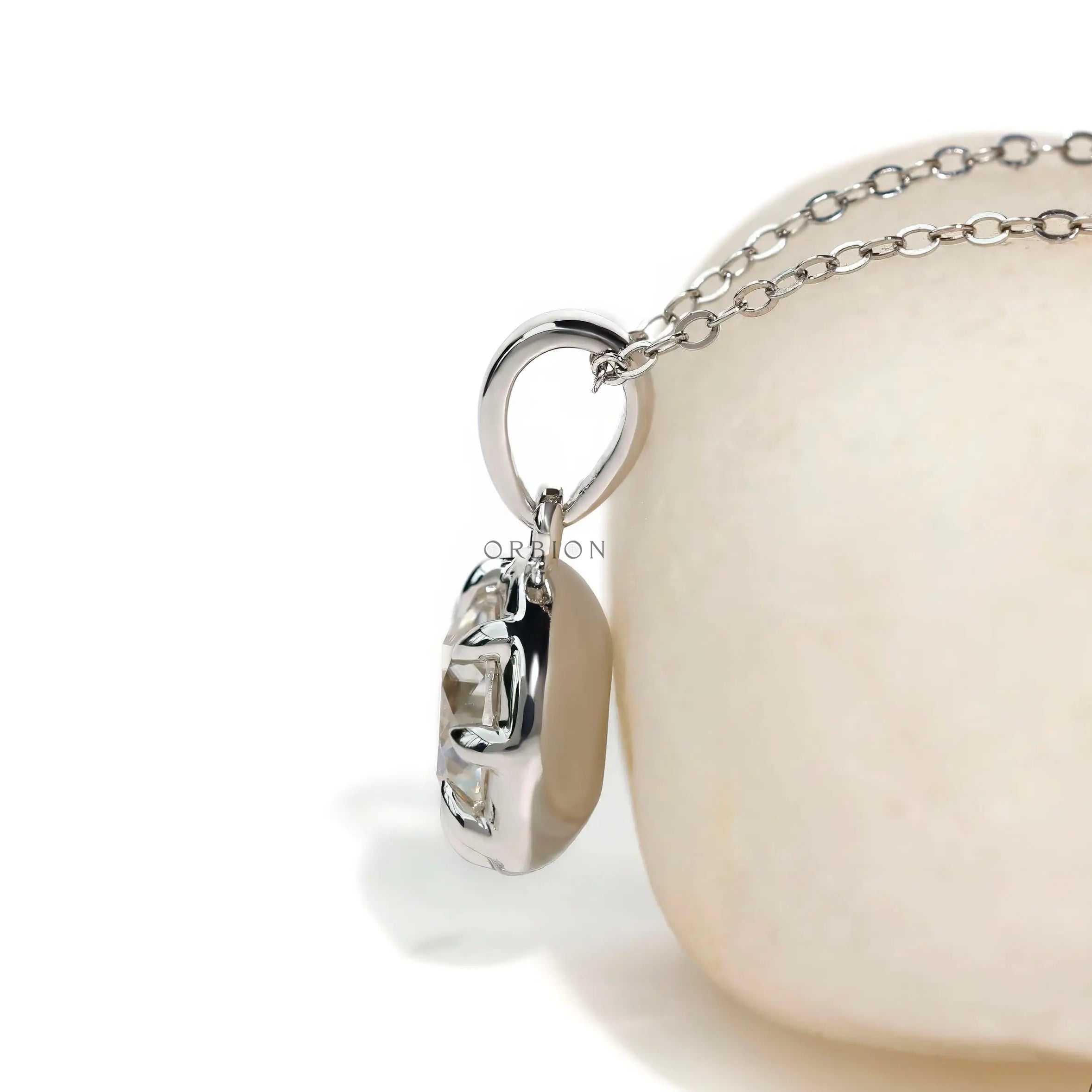 Eight prong round solitaire pendant in white gold