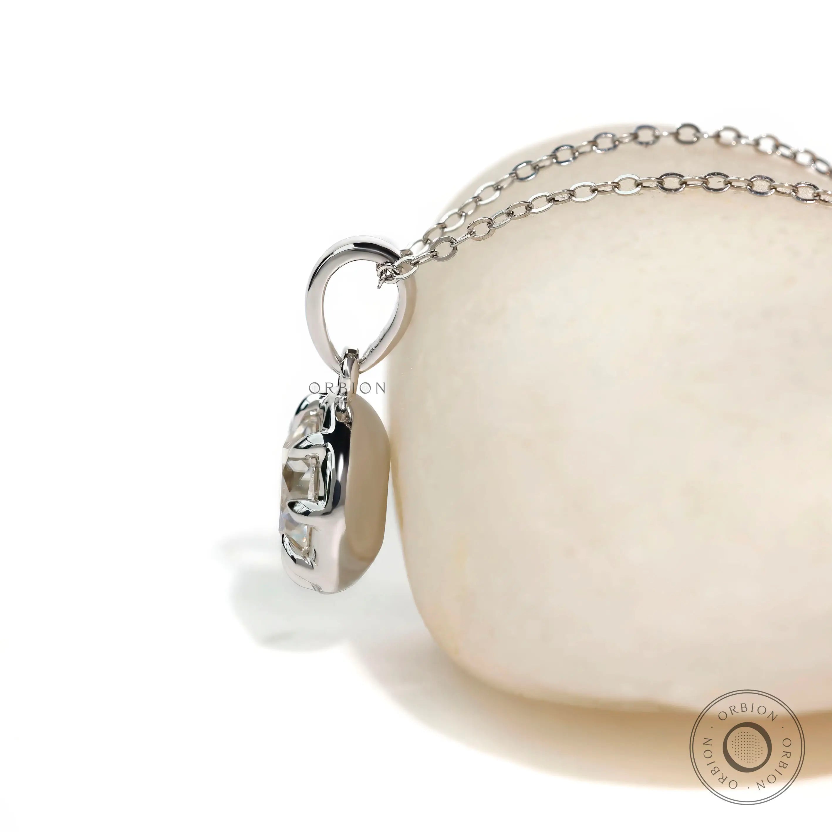 Eight prong round solitaire pendant in white gold