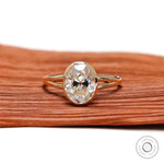 Oval moissanite bezel solitaire ring front view