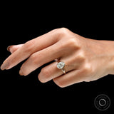 Oval moissanite bezel ring on finger top view