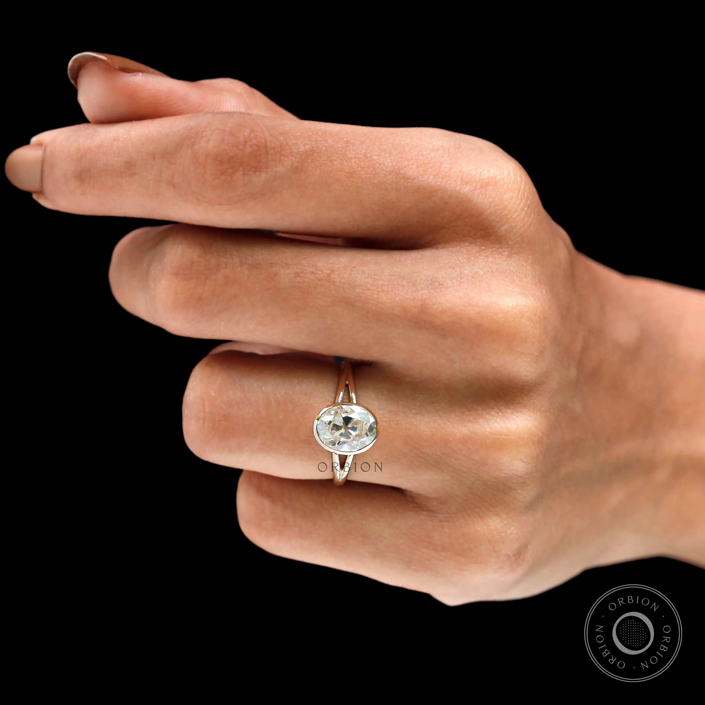 Bezel split shank solitaire ring worn angled view