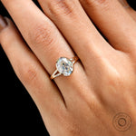 Oval bezel moissanite ring natural hand scale view