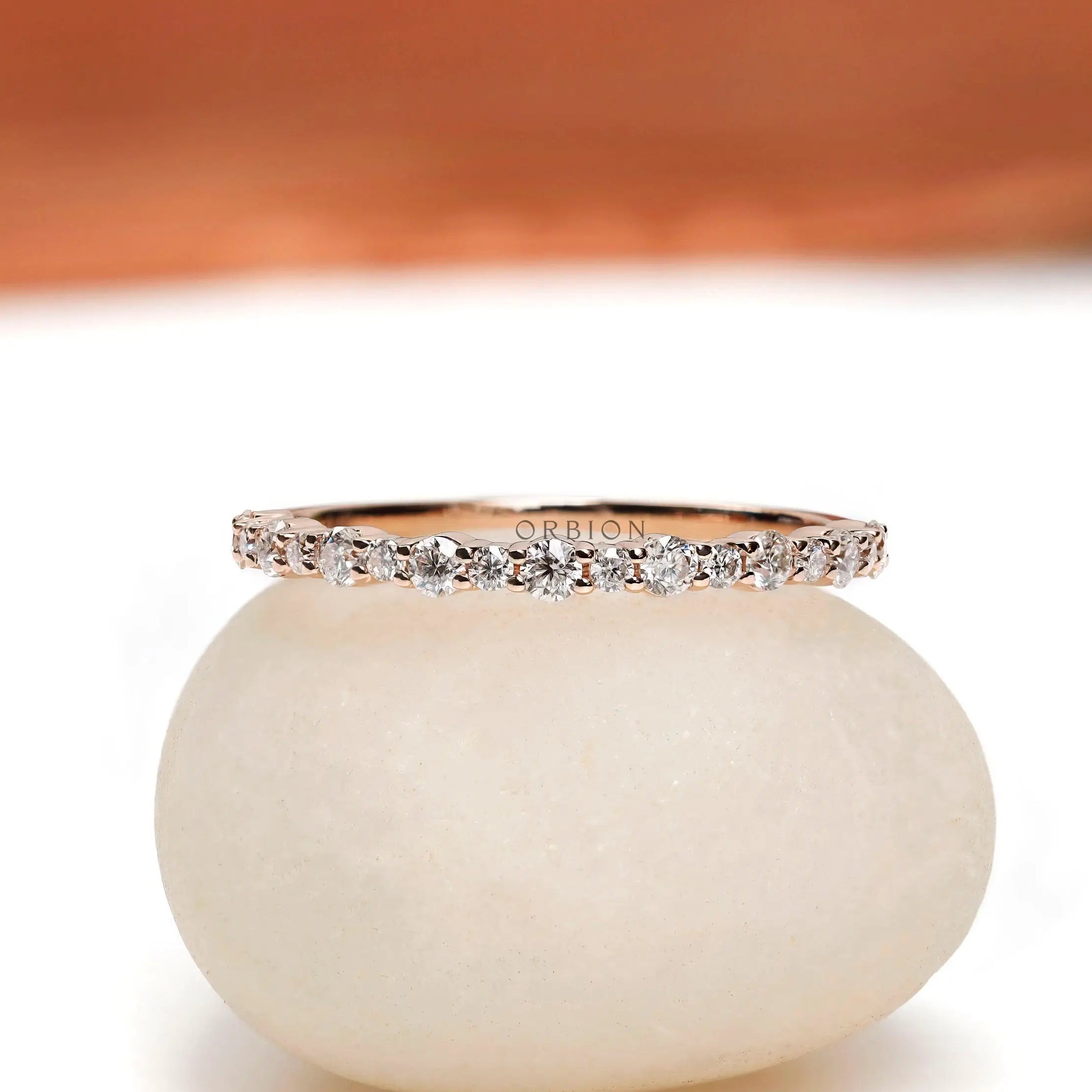 Front view of minimalist half eternity moissanite band
