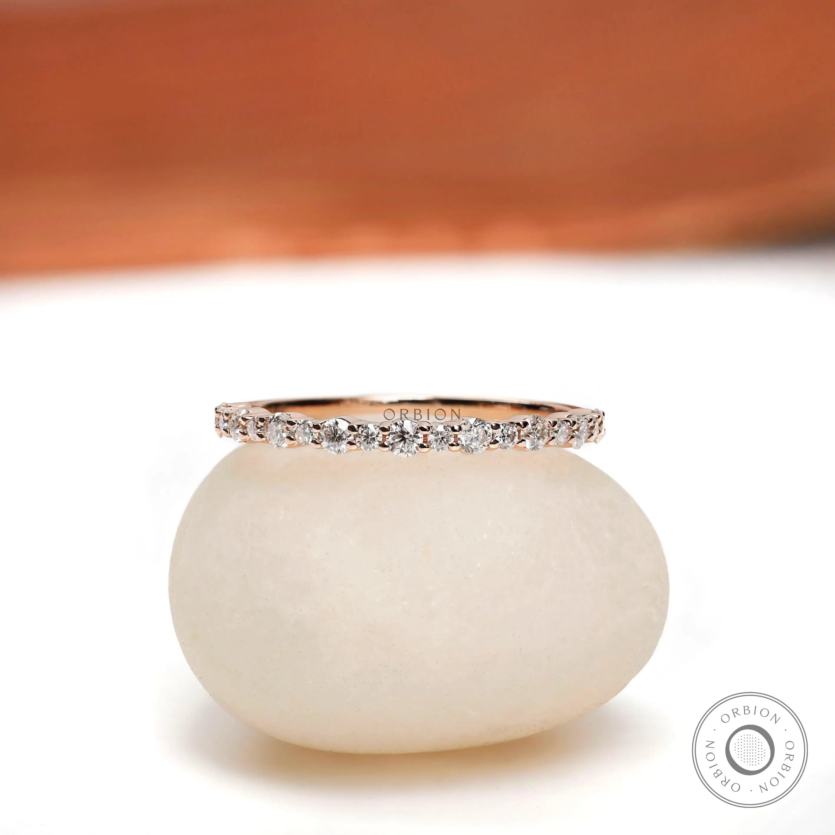 Front view of minimalist half eternity moissanite band