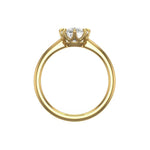 Front profile view showing slim yellow gold band and cushion crown