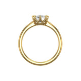 Front profile view showing slim yellow gold band and cushion crown