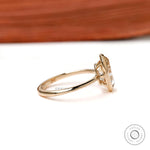 Side profile low bezel setting on slim yellow gold band