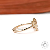 Side profile low bezel setting on slim yellow gold band