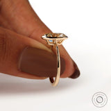 Hand held side view showing low profile oval bezel