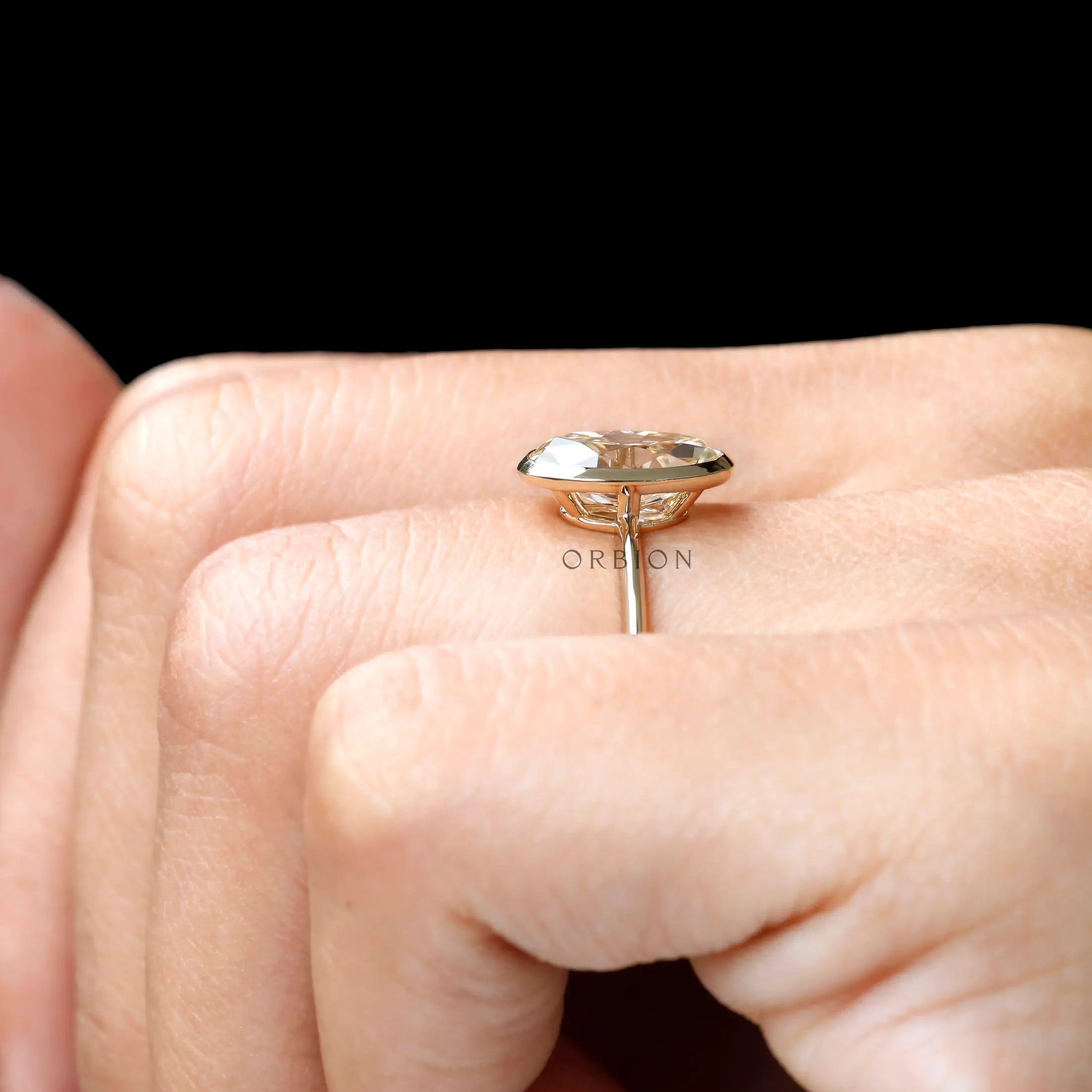 On finger side view showing bezel height and slim band
