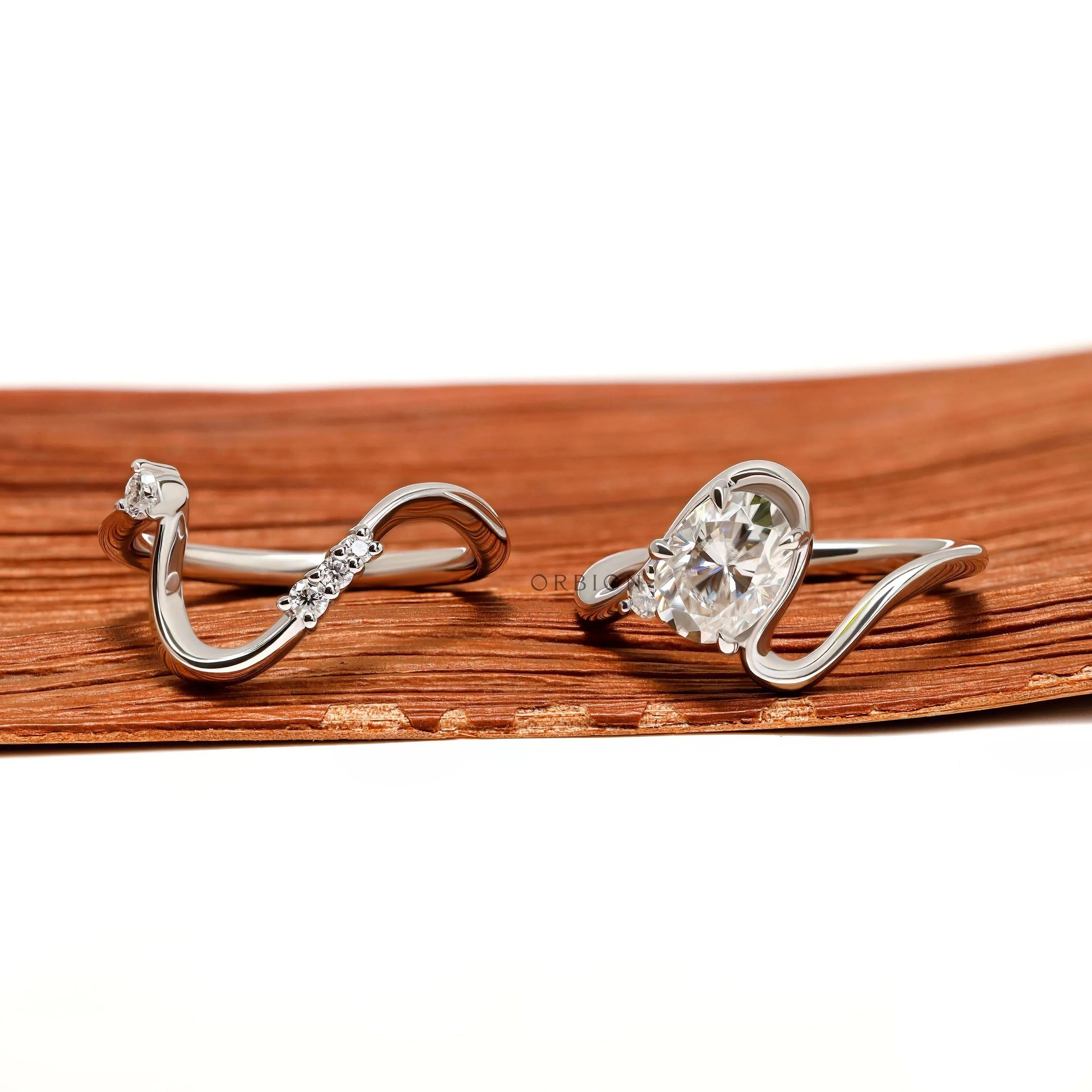 Wavy Bypass Style Wedding Ring Set with Oval Moissanite Center Stone