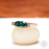 Angled front view showing elongated blue green and geometric diamond side details.