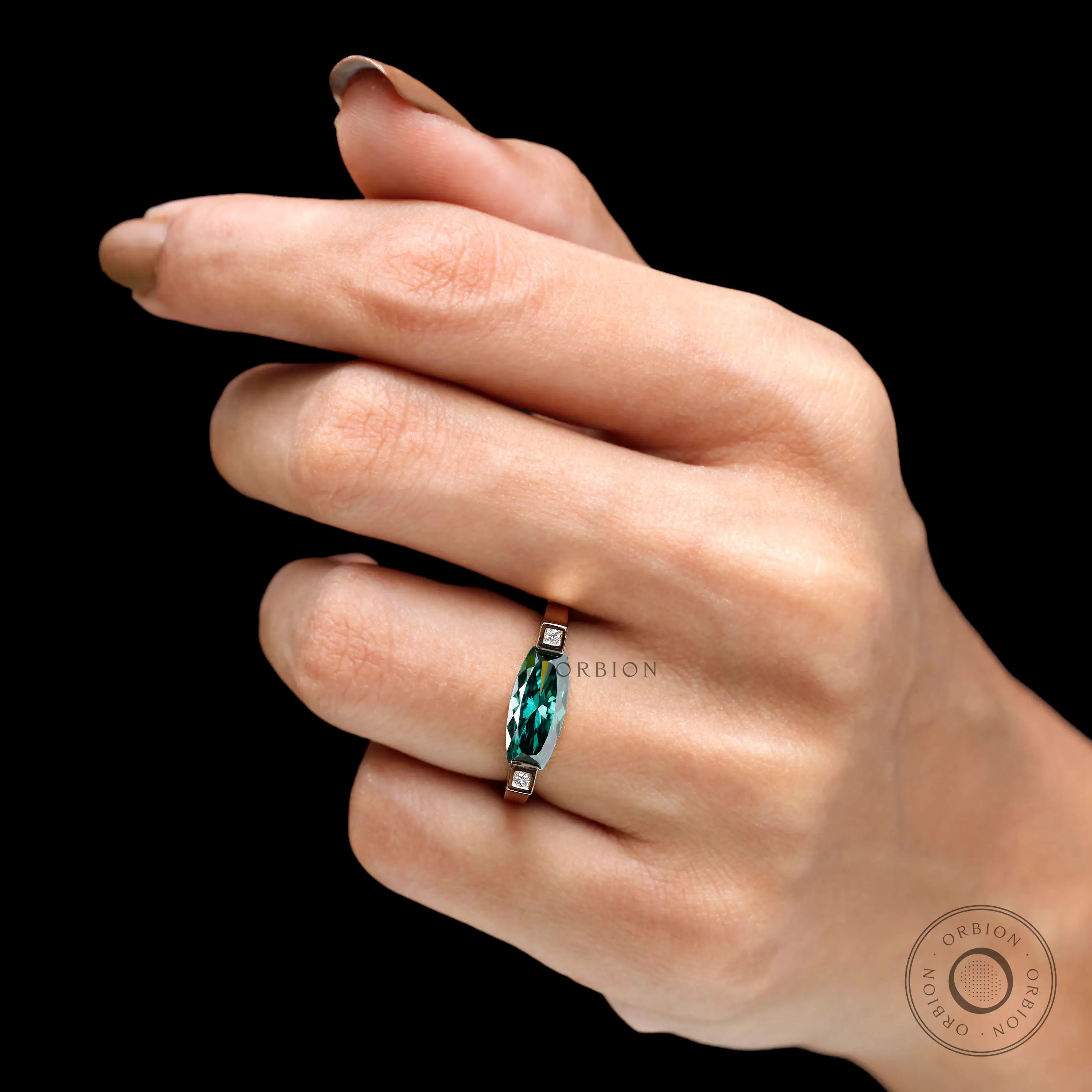 On-hand full view showcasing bold east west statement design in yellow gold.