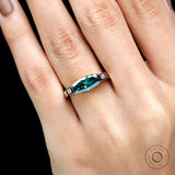 On-hand close top view highlighting refined edges, and elongated silhouette.