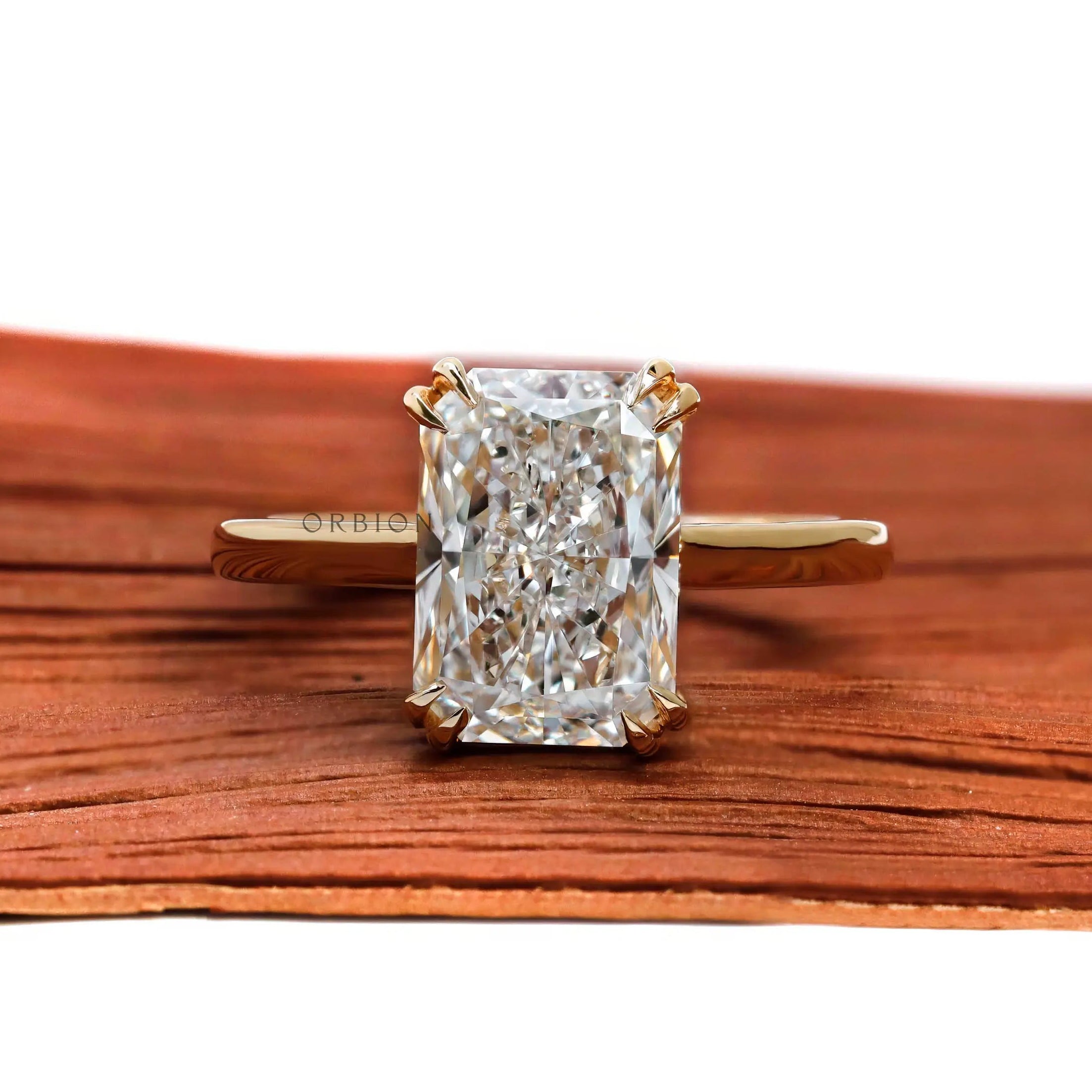 Radiant cut lab diamond solitaire engagement ring in 18K yellow gold front view
