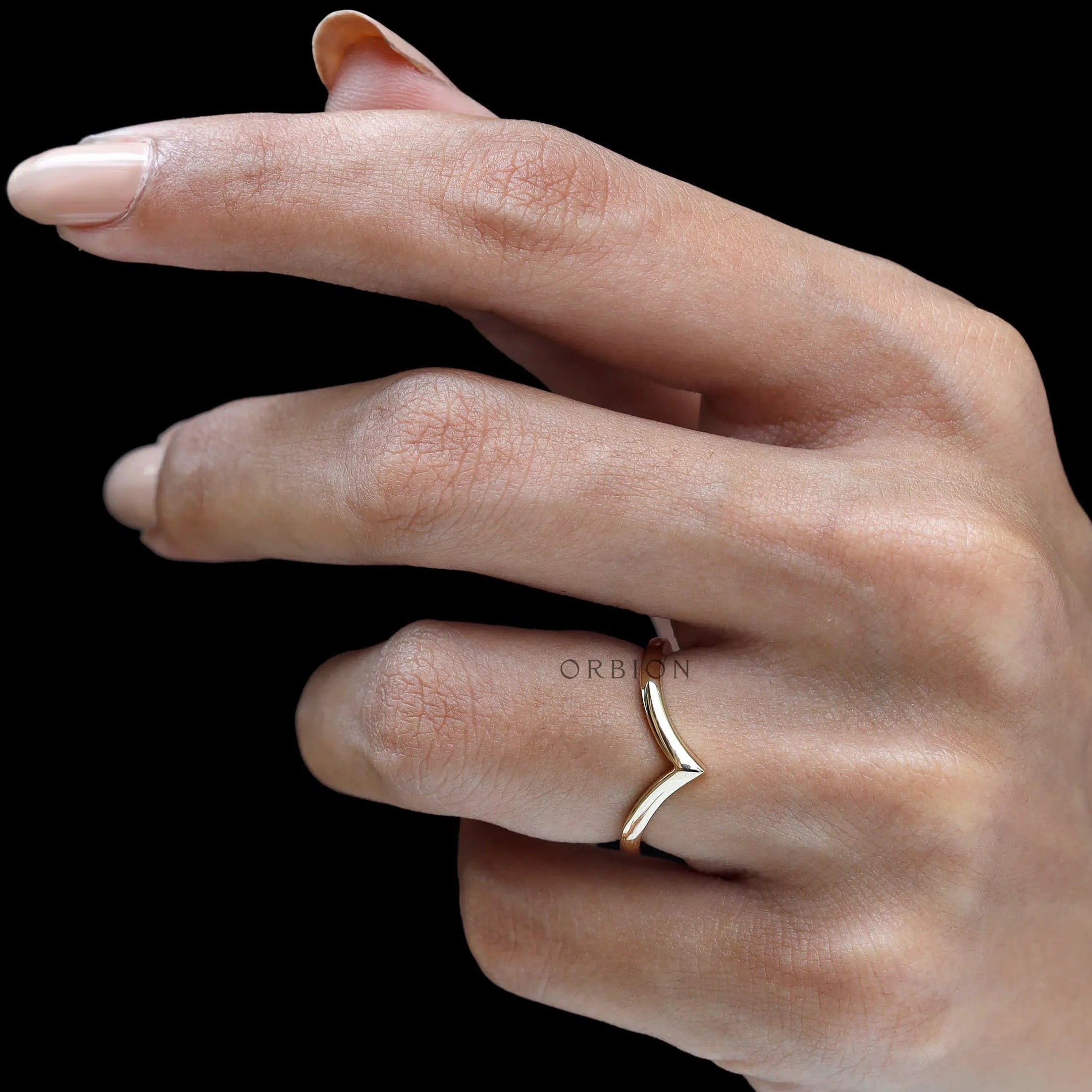Angled on-hand shot showing nesting V contour design.