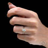 On-hand side profile showing low, delicate tulip setting in yellow gold.