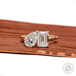 Front view of toi et moi ring with pear and emerald lab diamonds.