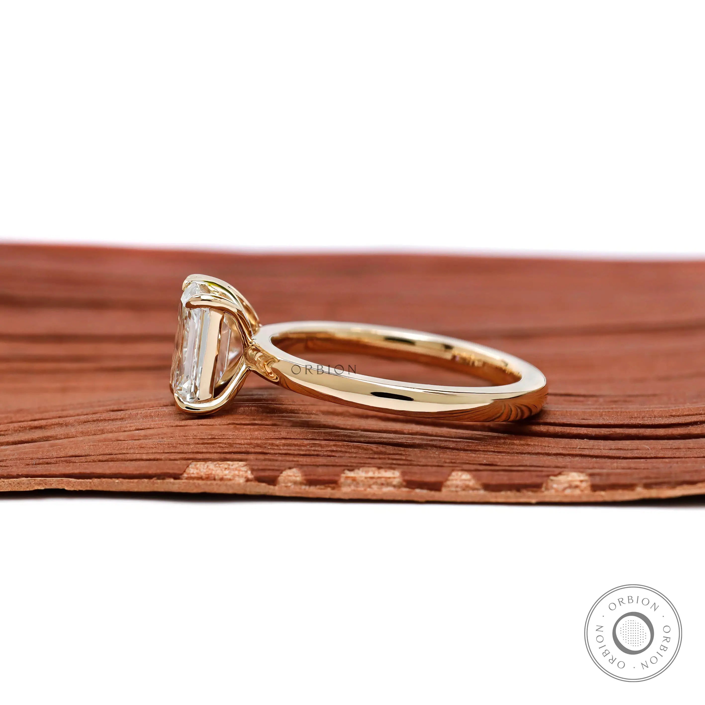 Side profile showing low set prongs and elegant two stone structure.
