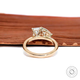 Back gallery view revealing dual basket settings and smooth gold band.