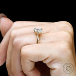 Profile on hand highlighting sleek band and minimal toi et moi design.
