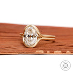 Angled view matte finish split shank oval moissanite ring