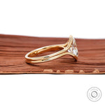 Side profile split shank ring with floating oval moissanite