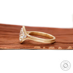 Side profile matte yellow gold floating half bezel ring
