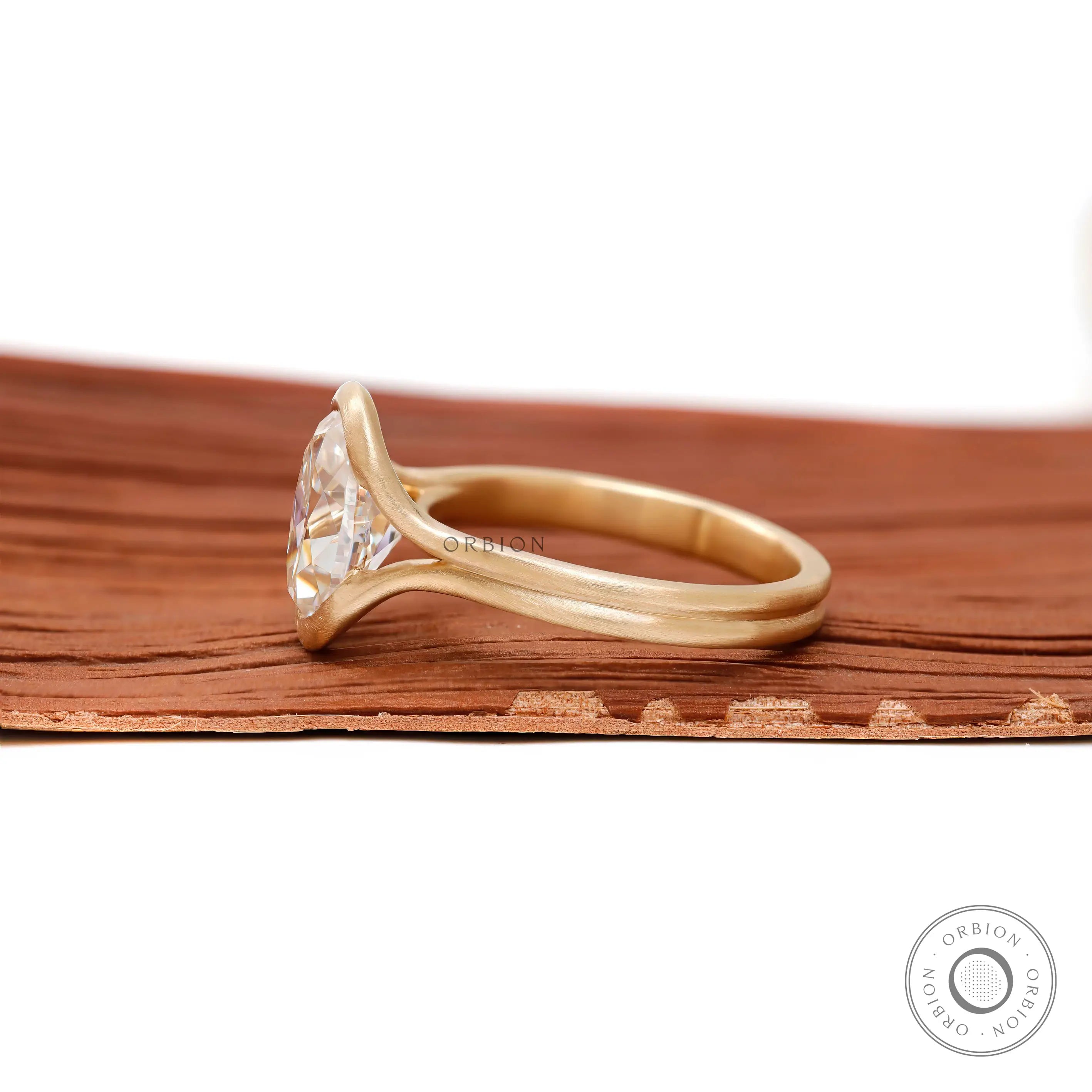 Side profile matte yellow gold floating half bezel ring