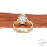 Rear view matte gold split shank oval moissanite setting