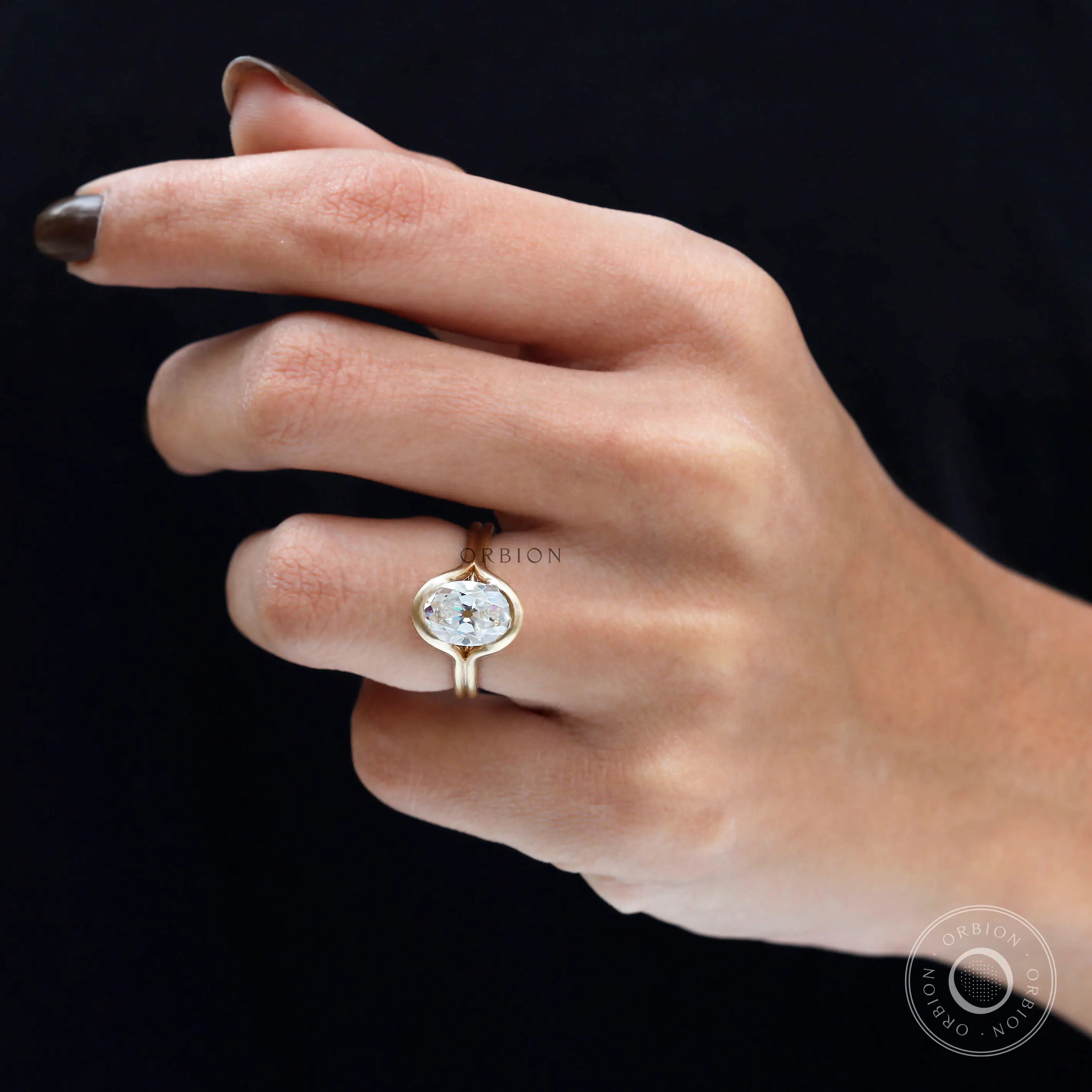 On hand matte yellow gold split shank oval ring