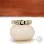 Mix-shape cluster eternity band in 10K yellow gold, front view.