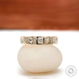 Mix-shape cluster eternity band in 10K yellow gold, front view.