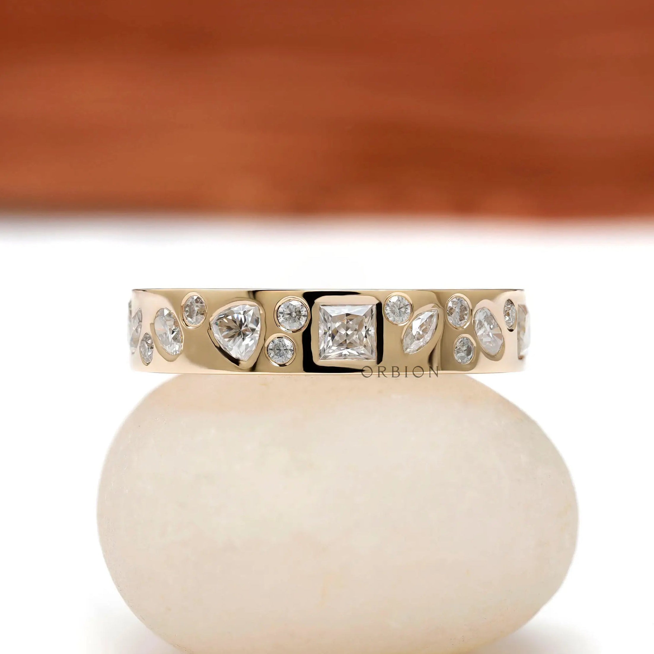 Mix-shape cluster eternity band in 10K yellow gold, front view.