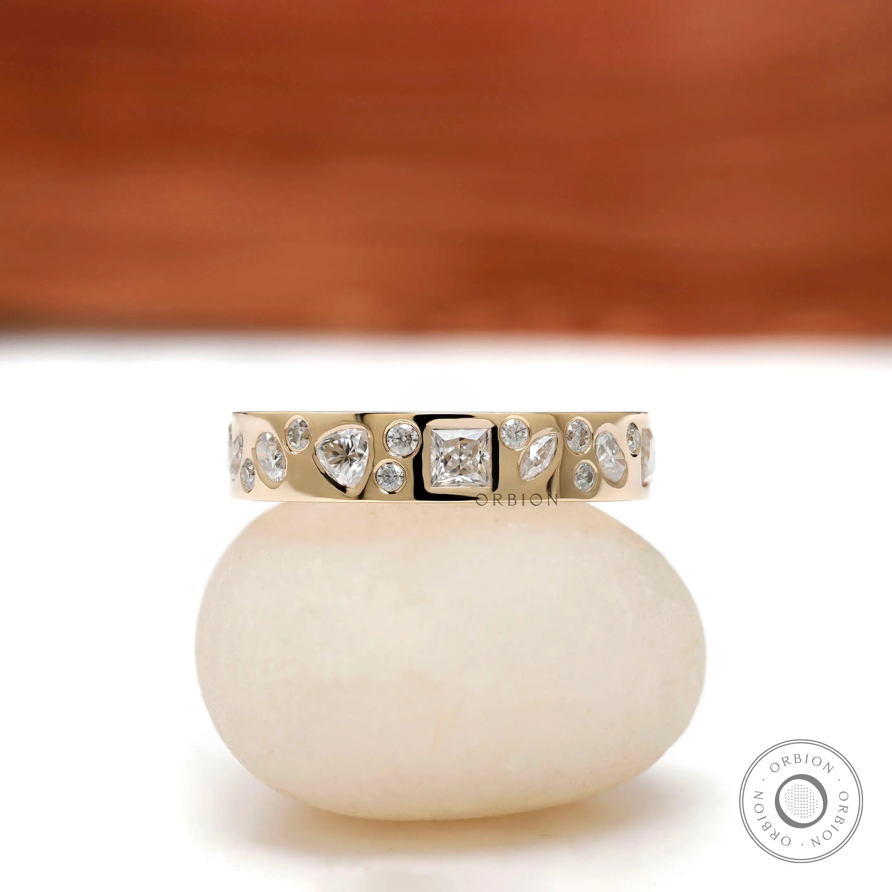 Mix-shape cluster eternity band in 10K yellow gold, front view.