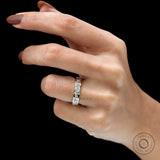 Mix-shape eternity wedding band worn on hand, lifestyle view.