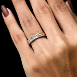 Angled on-hand shot showing sparkle and scattered stone arrangement.
