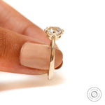 Elongated cushion solitaire diamond ring prong setting detail