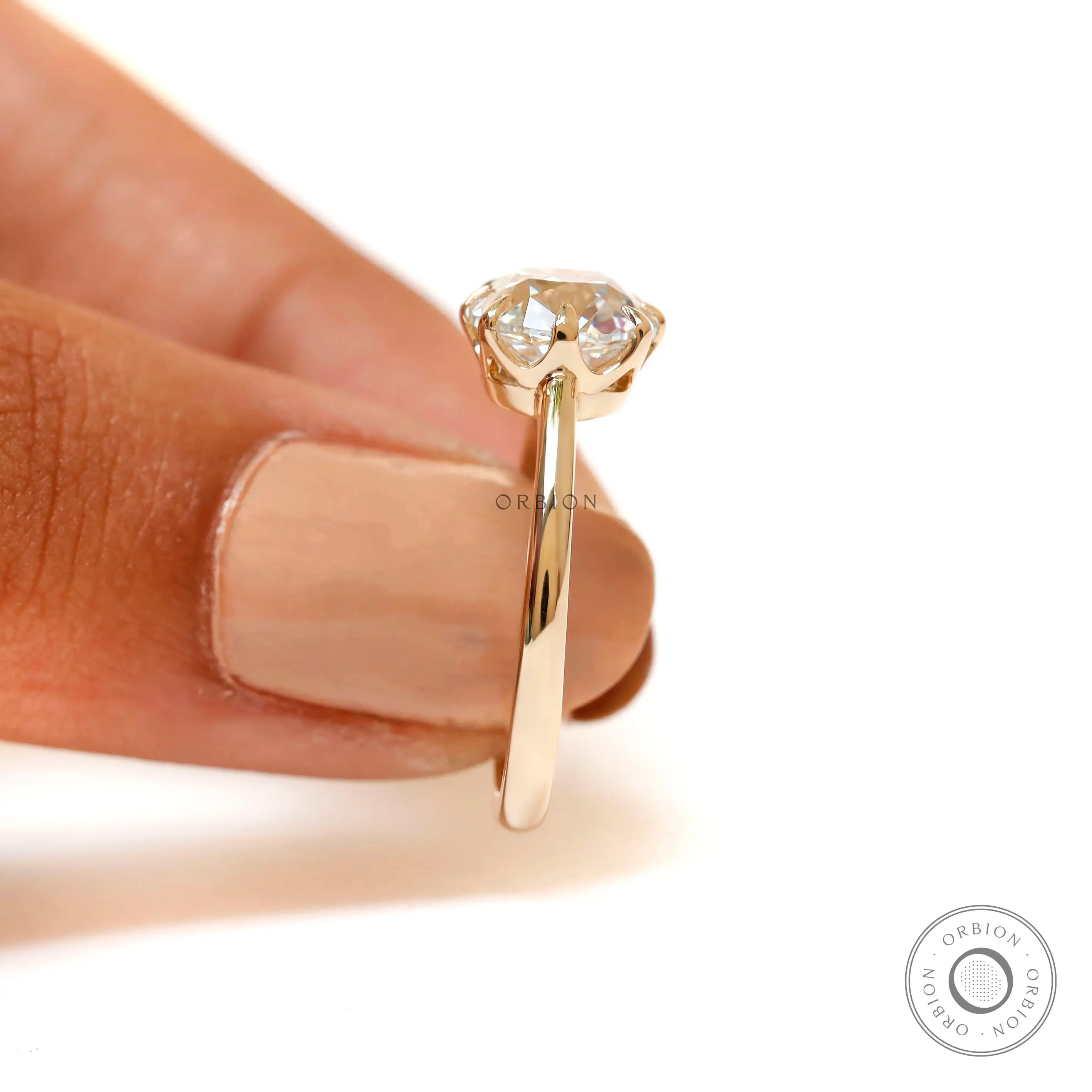Elongated cushion solitaire diamond ring prong setting detail