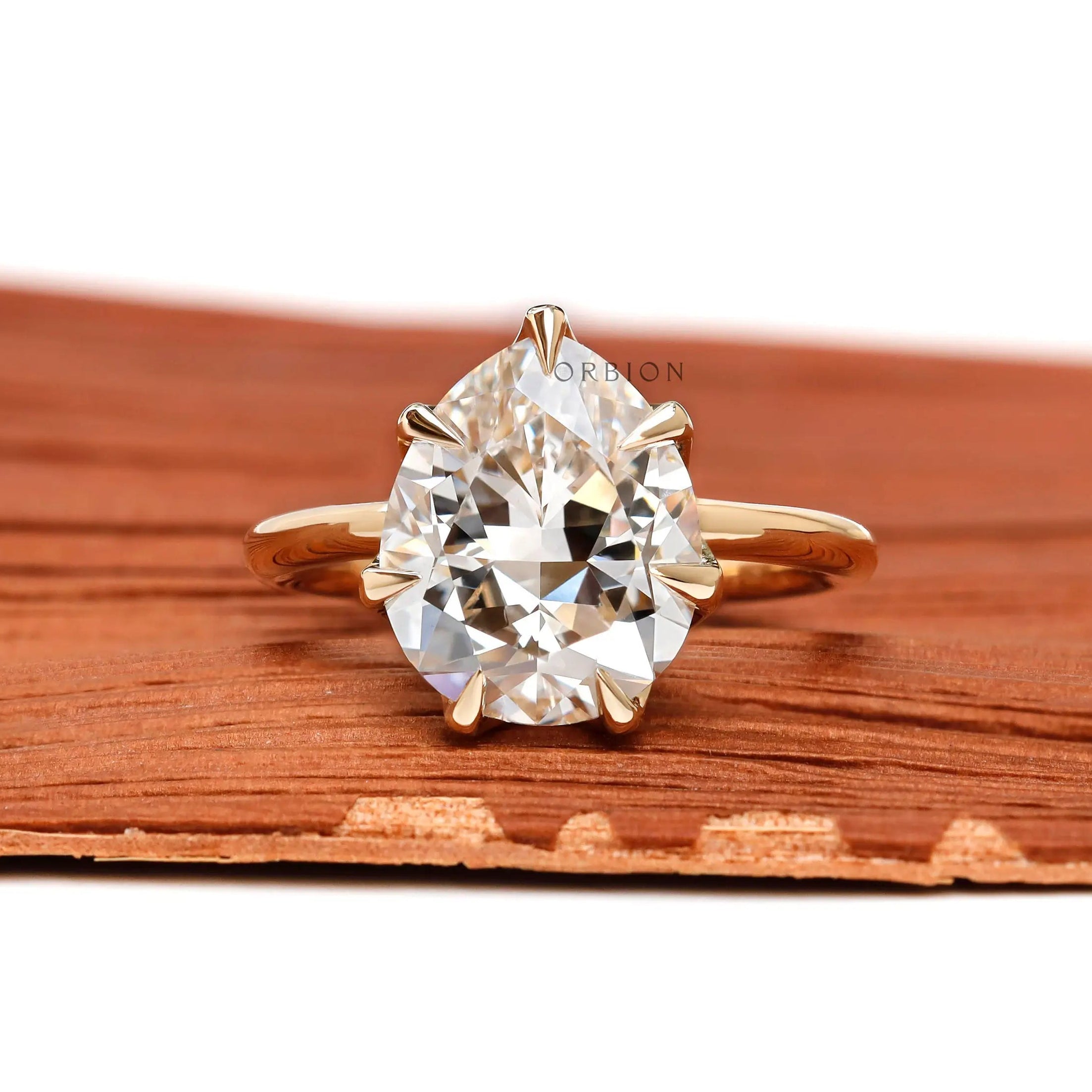 Front view fat pear lab grown diamond ring with vintage crown prongs