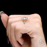 Low profile crown setting displayed on hand against black background