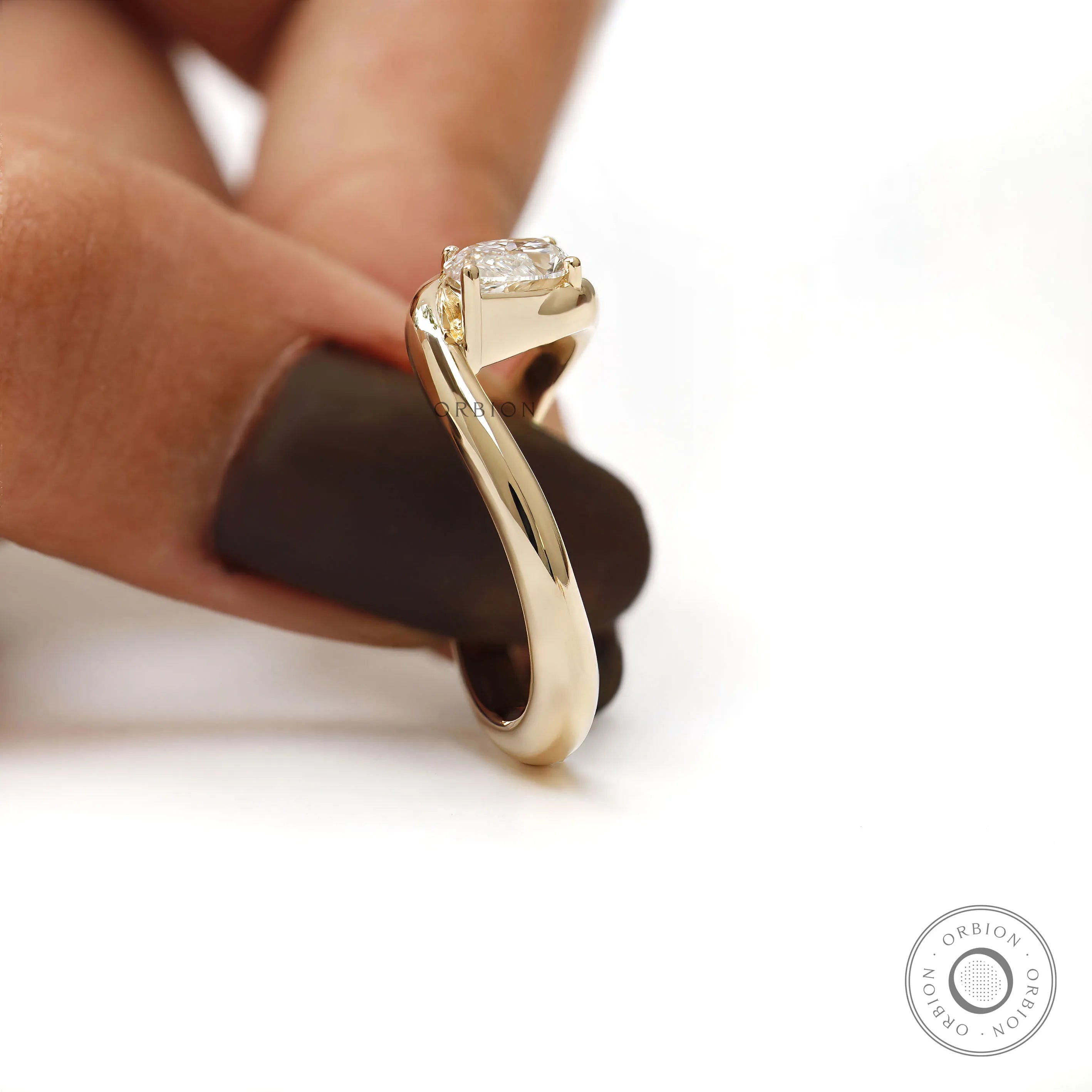 Modern marquise cut engagement ring in 14k yellow gold with solitaire setting