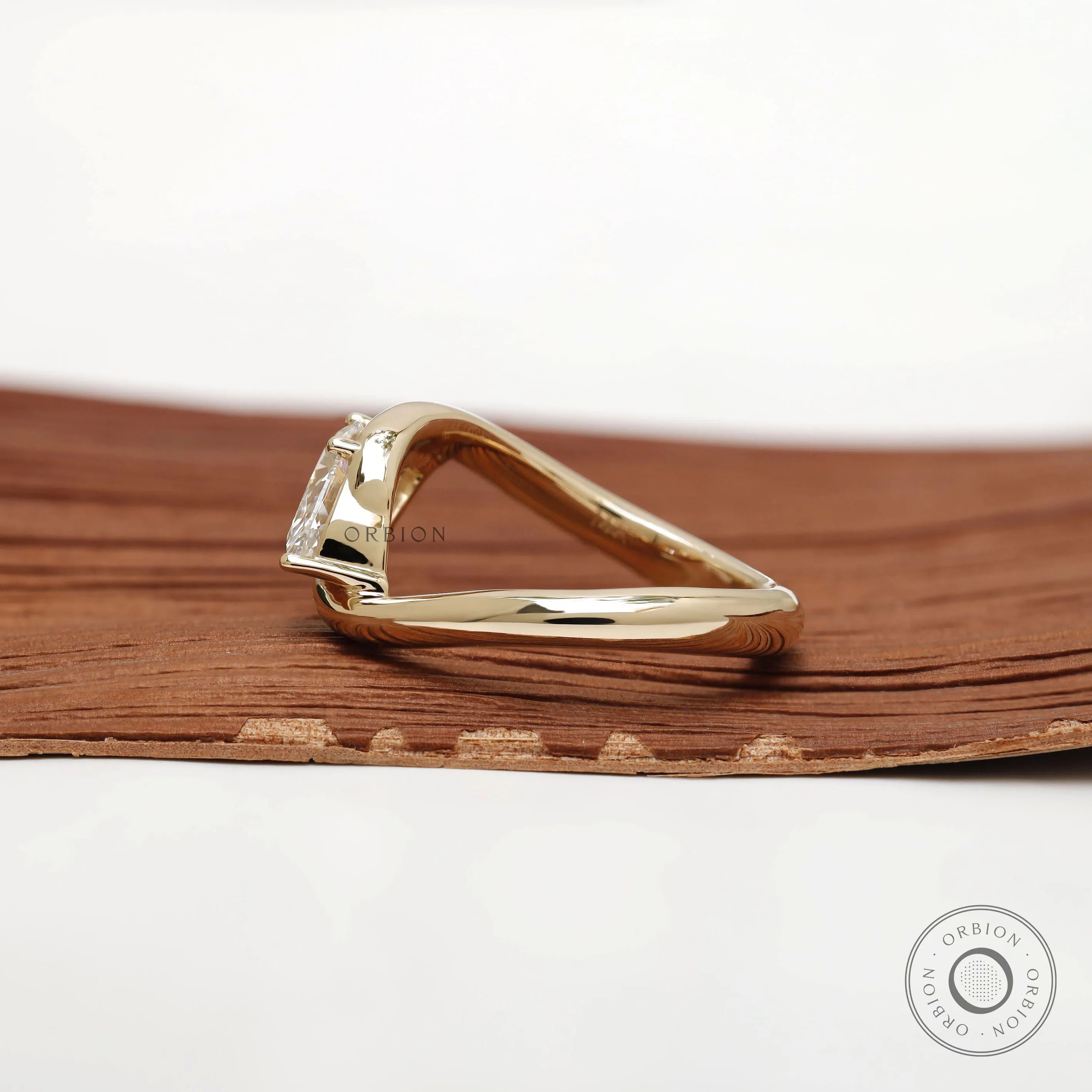 Marquise cut rapture curved ring with solitaire stone in yellow gold