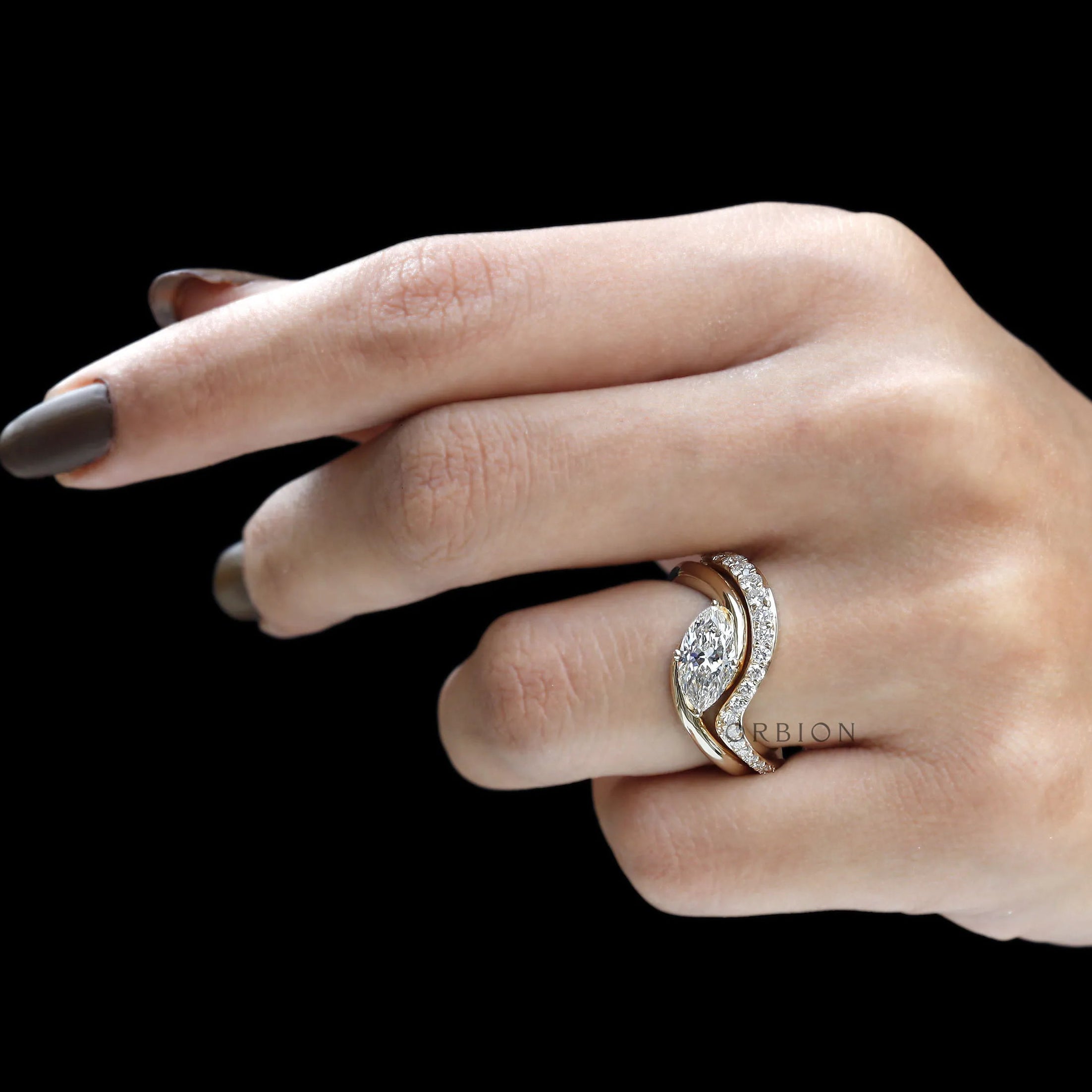 Marquise engagement ring and wedding band set in yellow gold